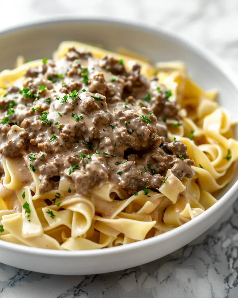 Ground Beef Stroganoff Recipe served Ground Beef Stroganoff Recipe: Creamy Comfort on a Budget