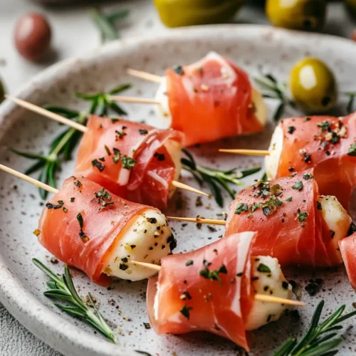 u6472731739 Prosciutto mozzarella bites with toothpicks on el 7ec2c275 a0c8 4dcc aef2 8d6e35988674 1 Beef Bresaola Wrapped Mozzarella (Only 4 Ingredients!)
