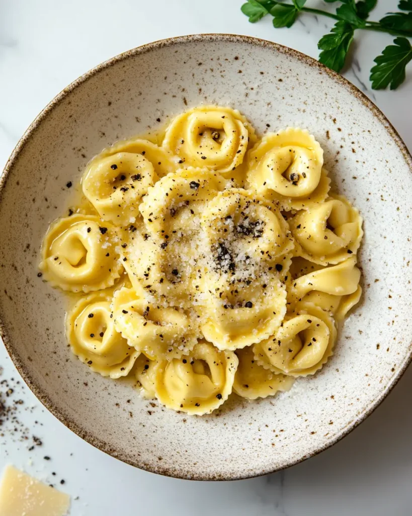 u6472731739 served creamy tortellini carbonara in rustic cera 3a809f27 6626 4bc8 94a7 2c7d92ab1965 2 30 Minute Creamy Tortellini Carbonara Recipe